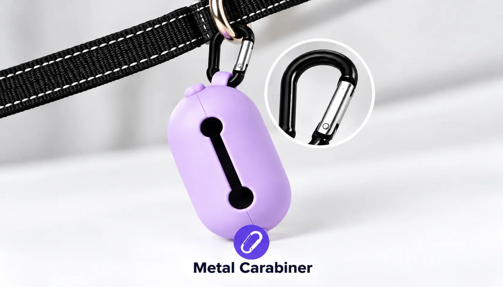 A lavender purple pet collar clip with a black metal carabiner, shown hanging from a black collar strap. A circular inset highlights the black metal carabiner, and the text 'Metal Carabiner' is displayed below.