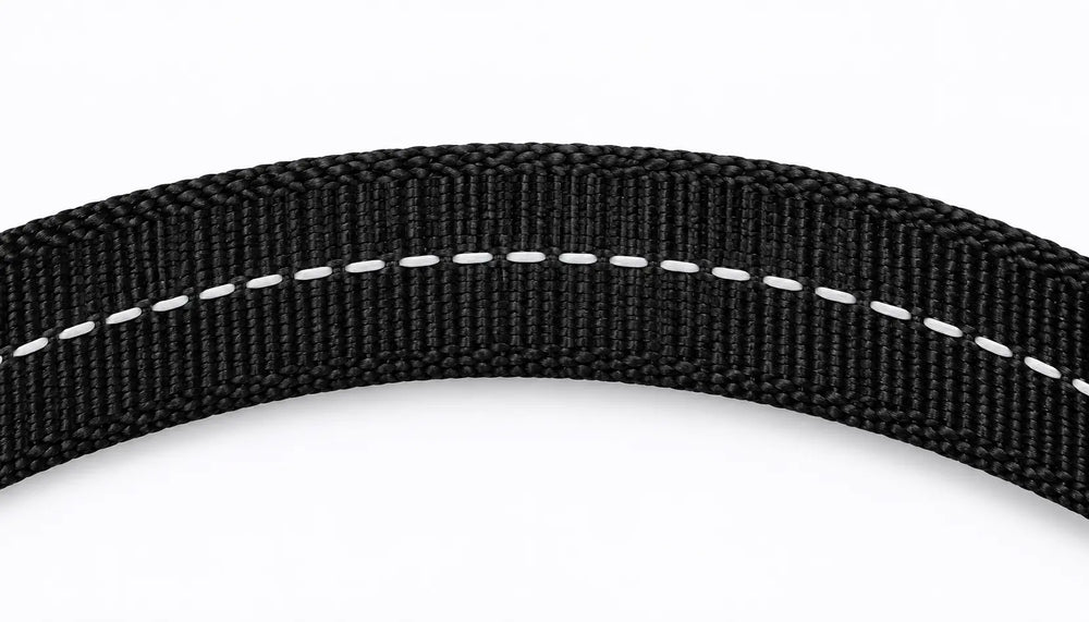 Close-up detail of durable, royal blue bungee webbing material used for LuxryPaw dog leashes and harnesses. Shows the flexible, textured weave and stretch capacity.