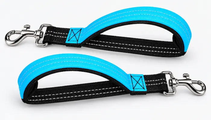 Two bright blue and black dog leash handles with silver metal clamps, displayed on a clean white background. luxrypaw bungee leash