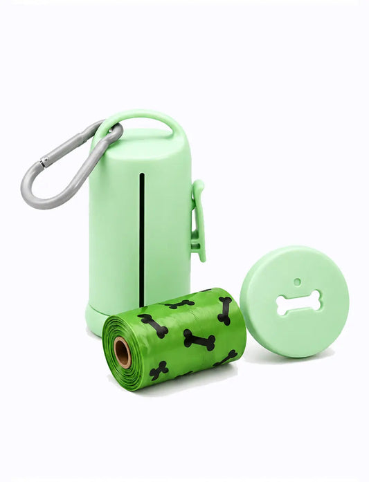 LuxryPaw light green dog waste bag dispenser with plastic clip and a roll of green bags featuring black bone patterns.