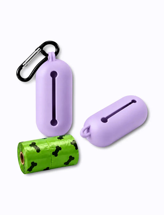 lilac LuxryPaw silicone pet waste bag holder with metal carabiner and a roll of green bone-print poop bags